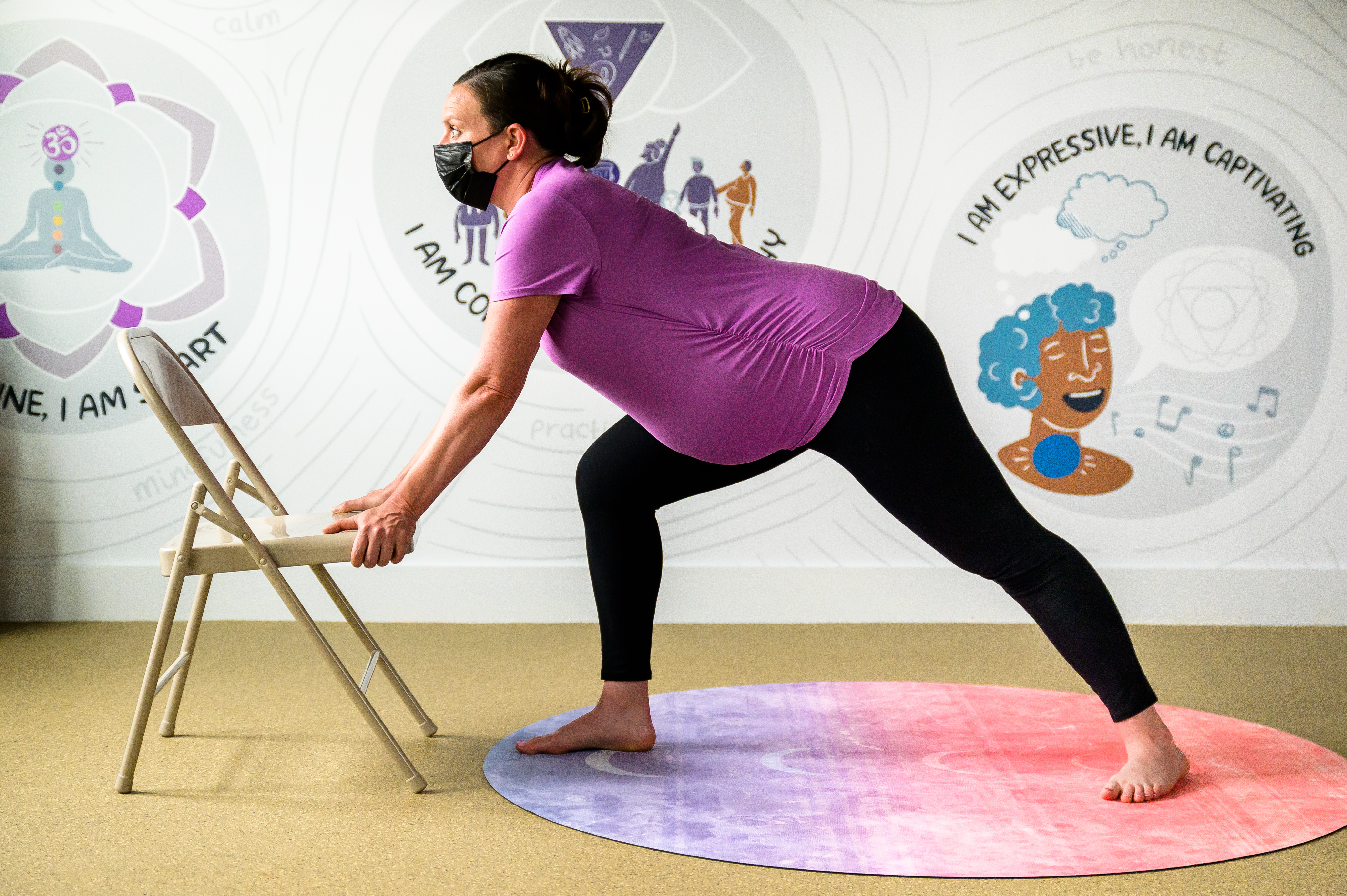 Wall Mural Pregnant woman doing yoga exercise 
